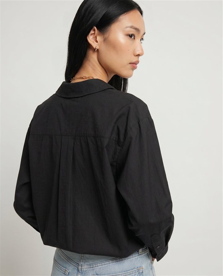 Generated back-view model shot of the black shirt